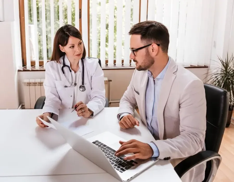 Two healthcare administrators in meeting discussing hospital needs